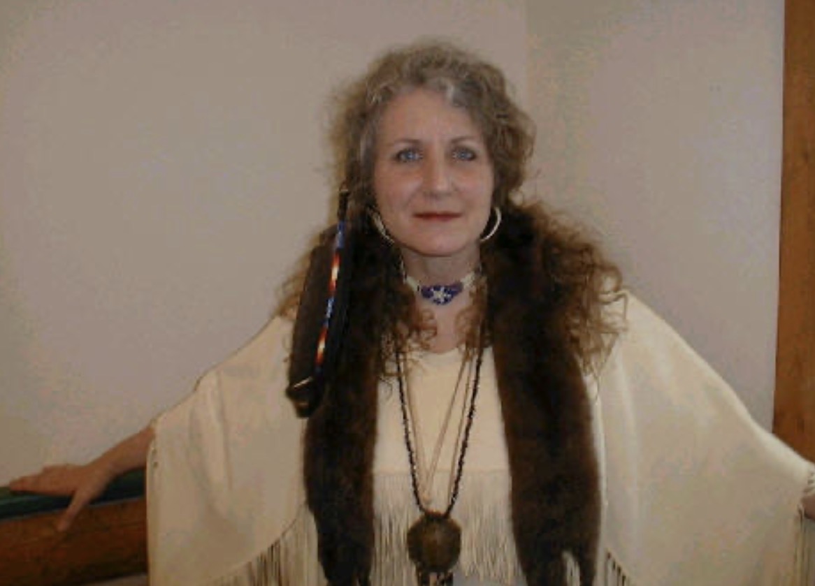 Bunny in traditional Native American attire with fringe and necklace